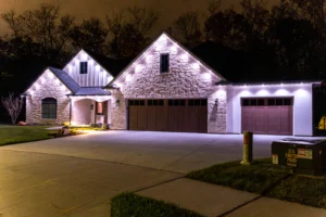 A house at night with permanent white led lights framing the house