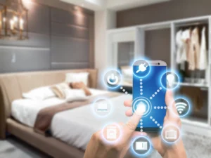 Person using a smart phone for their smart home lighting in a bed room